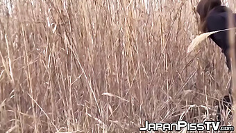 Young Japanese Schoolgirls Pause To Urinate Outdoors In The Warm Weather